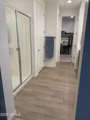 a view of a hallway to rooms