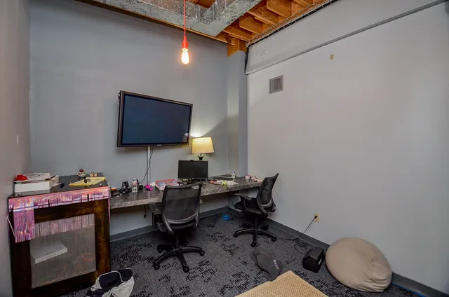 a room with furniture and a flat screen tv