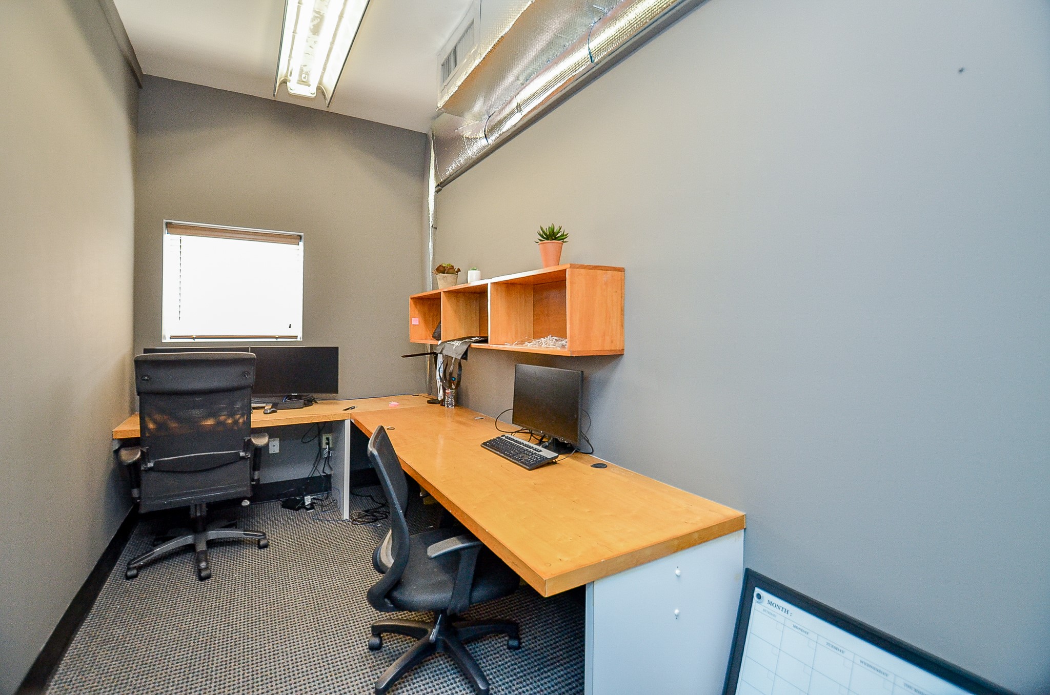 5712 Val Verde Street Houston, TX 77057 - Photo 20 of 50 a room with a table chairs and wooden floor