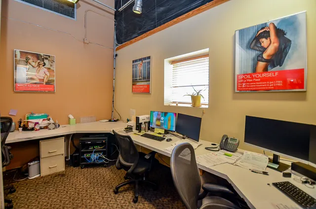 a view of a workspace with furniture