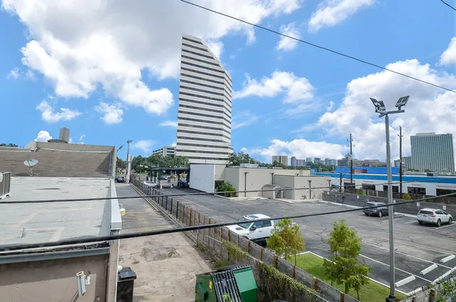 a view of a patio with table and chairs with an umbrella