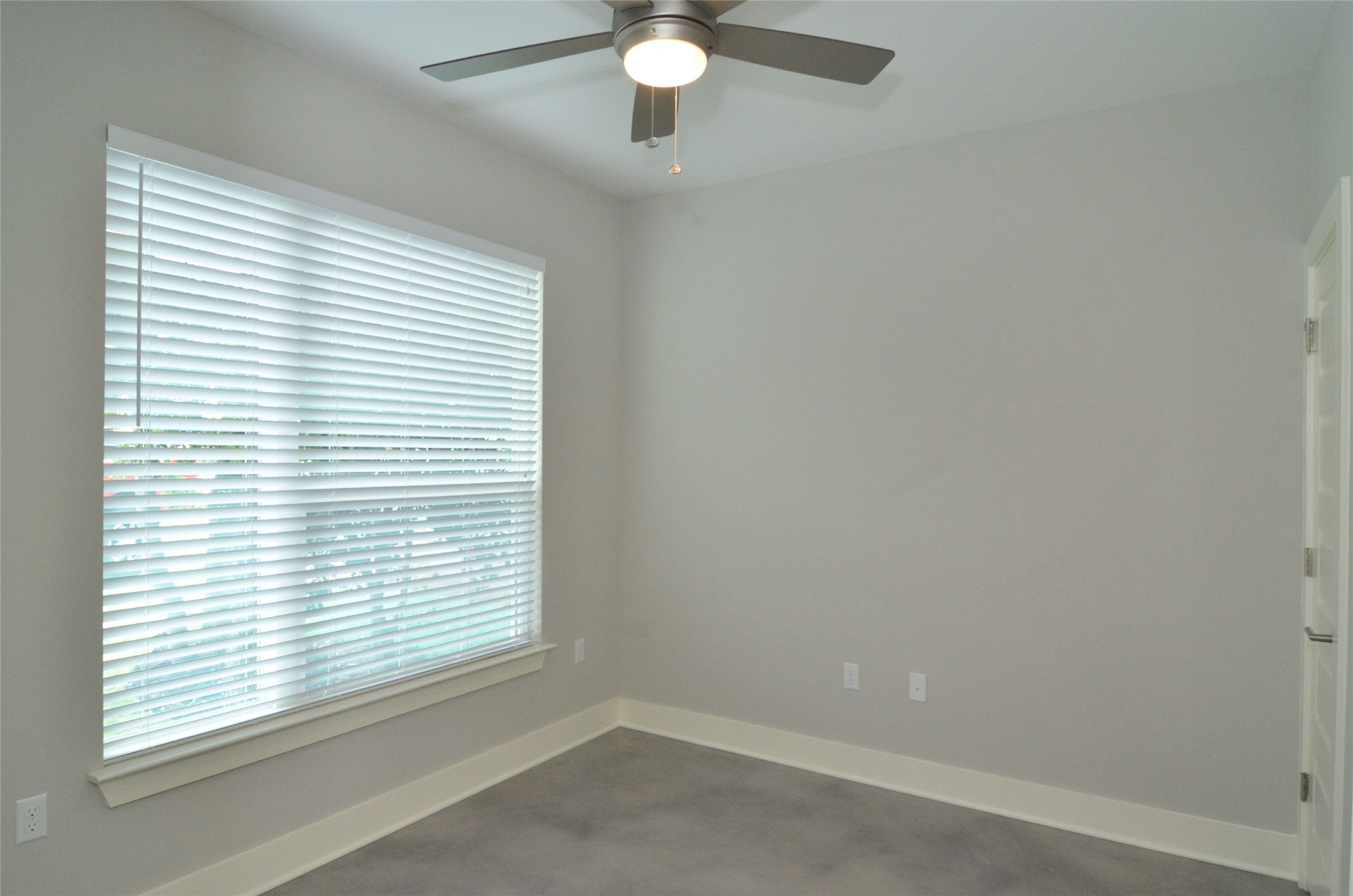 1916 Cleese Drive Austin, TX 78741 - Photo 14 of 36 Well-lit room featuring durable flooring and convenient overhead cooling.