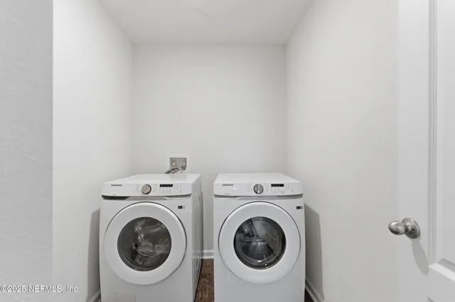 a utility room with dryer and washer