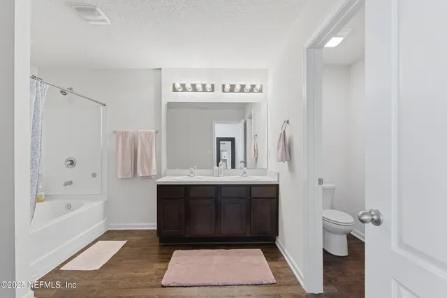 a kitchen with stainless steel appliances a refrigerator stove microwave and sink