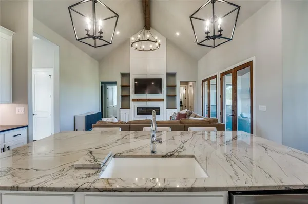a kitchen with stainless steel appliances kitchen island a large island in the center