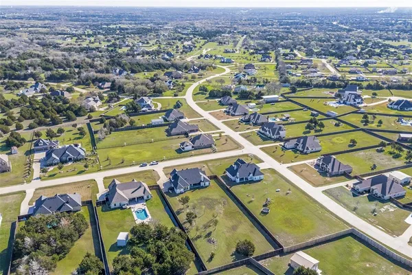 an aerial view of a house with outdoor space