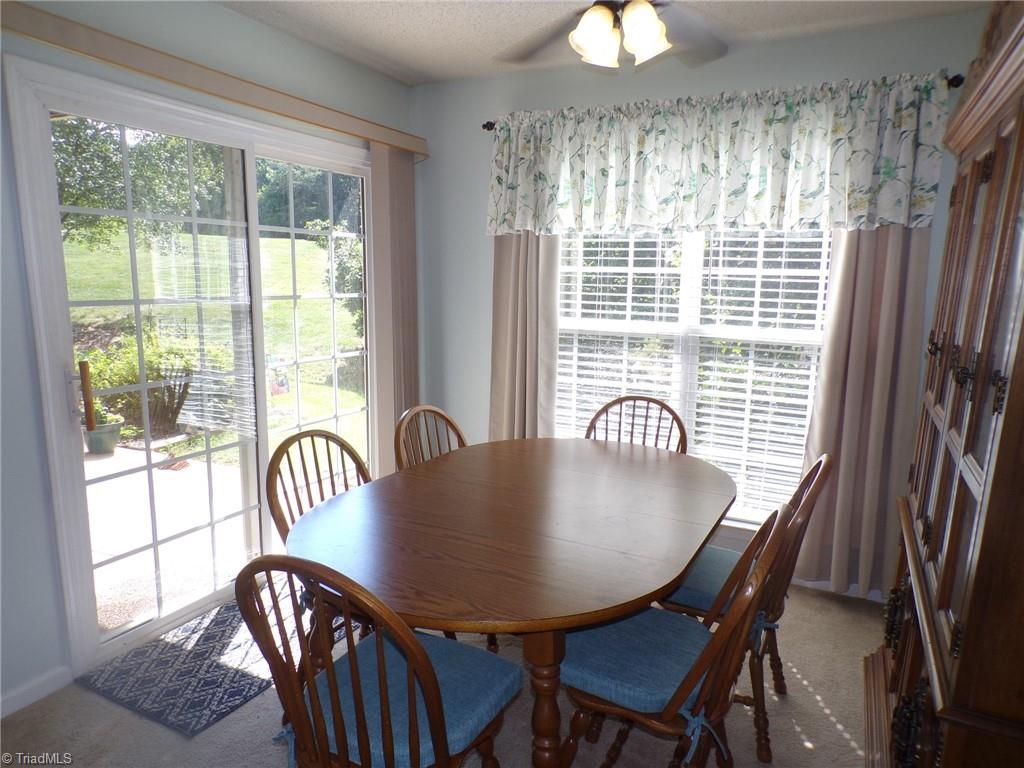 5005 Bass Chapel Road, Unit 1C Greensboro, NC 27455 - Photo 6 of 34 Dining room with sliding glass doors.