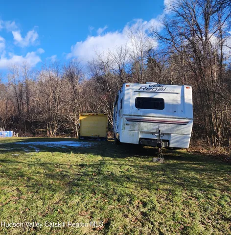 a swimming pool with trees in the background
