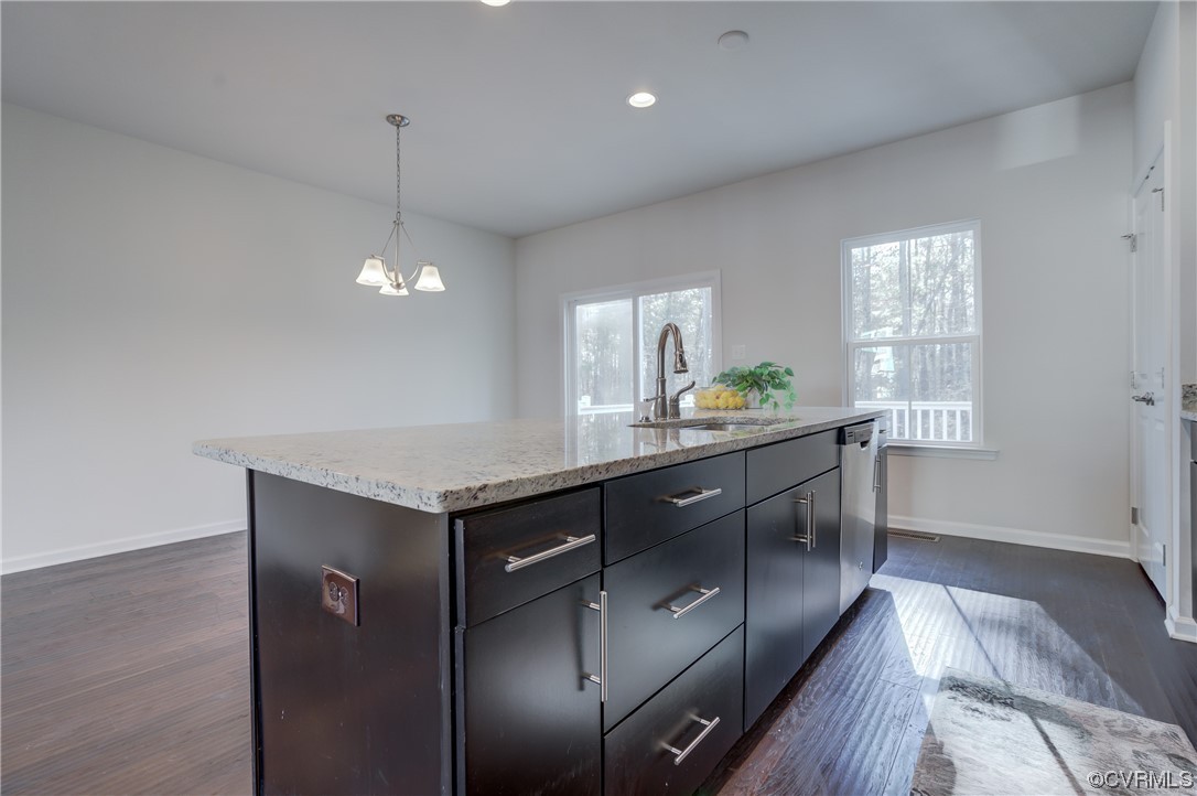 429 Crofton Village Terrace Midlothian, VA 23114 - Photo 12 of 35 a kitchen with granite countertop a oven a sink cabinets and wooden floor