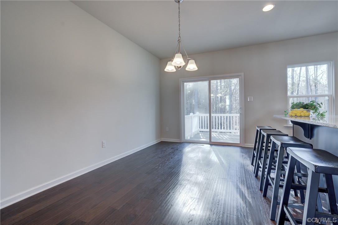 429 Crofton Village Terrace Midlothian, VA 23114 - Photo 13 of 35 a view of a dining room with furniture wooden floor and chandelier