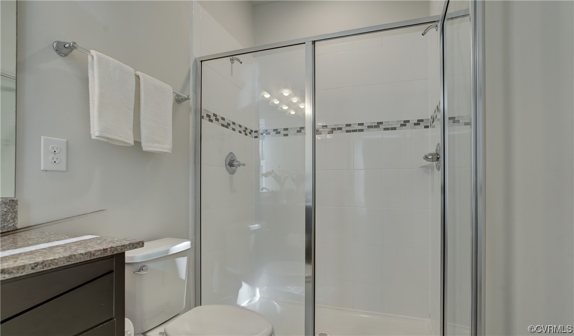 429 Crofton Village Terrace Midlothian, VA 23114 - Photo 22 of 35 a bathroom with a granite countertop sink toilet and shower