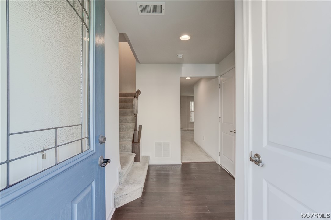 429 Crofton Village Terrace Midlothian, VA 23114 - Photo 3 of 35 a view of a hallway with wooden floor and staircase
