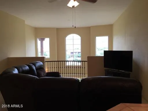 a bathroom with a shower curtain and a toilet