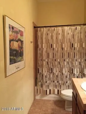 a view of a grassy area with mountains and valleys in the background