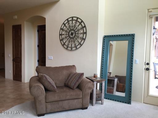 Undisclosed Address Gold Canyon, AZ 85118 - Photo 7 of 45 a living room with furniture and a fireplace