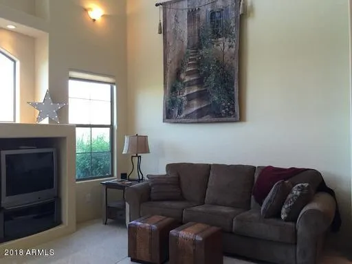 a kitchen with granite countertop a refrigerator and a sink
