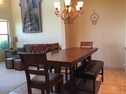 Undisclosed Address Gold Canyon, AZ 85118 - Photo 9 of 45 a view of a dining room with furniture and wooden floor