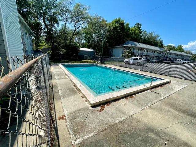 a view of swimming pool with chairs