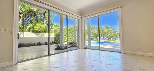 a view of a kitchen with a large window