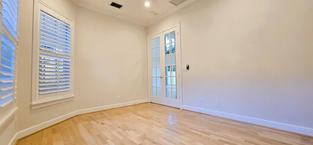 a view of an entryway with wooden floor