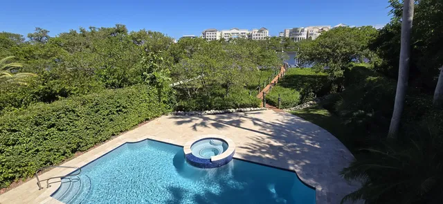 a view of a building with potted plants