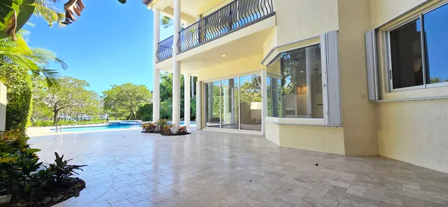 a view of a swimming pool with a patio