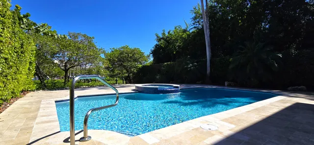 a view of a house with backyard and porch