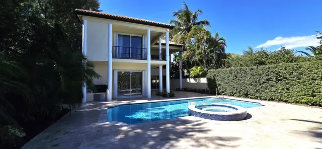 a view of a pathway with a wrought fence