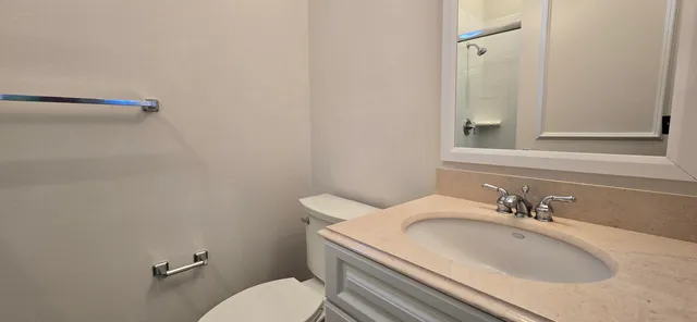 a view of walk in closet with clothes