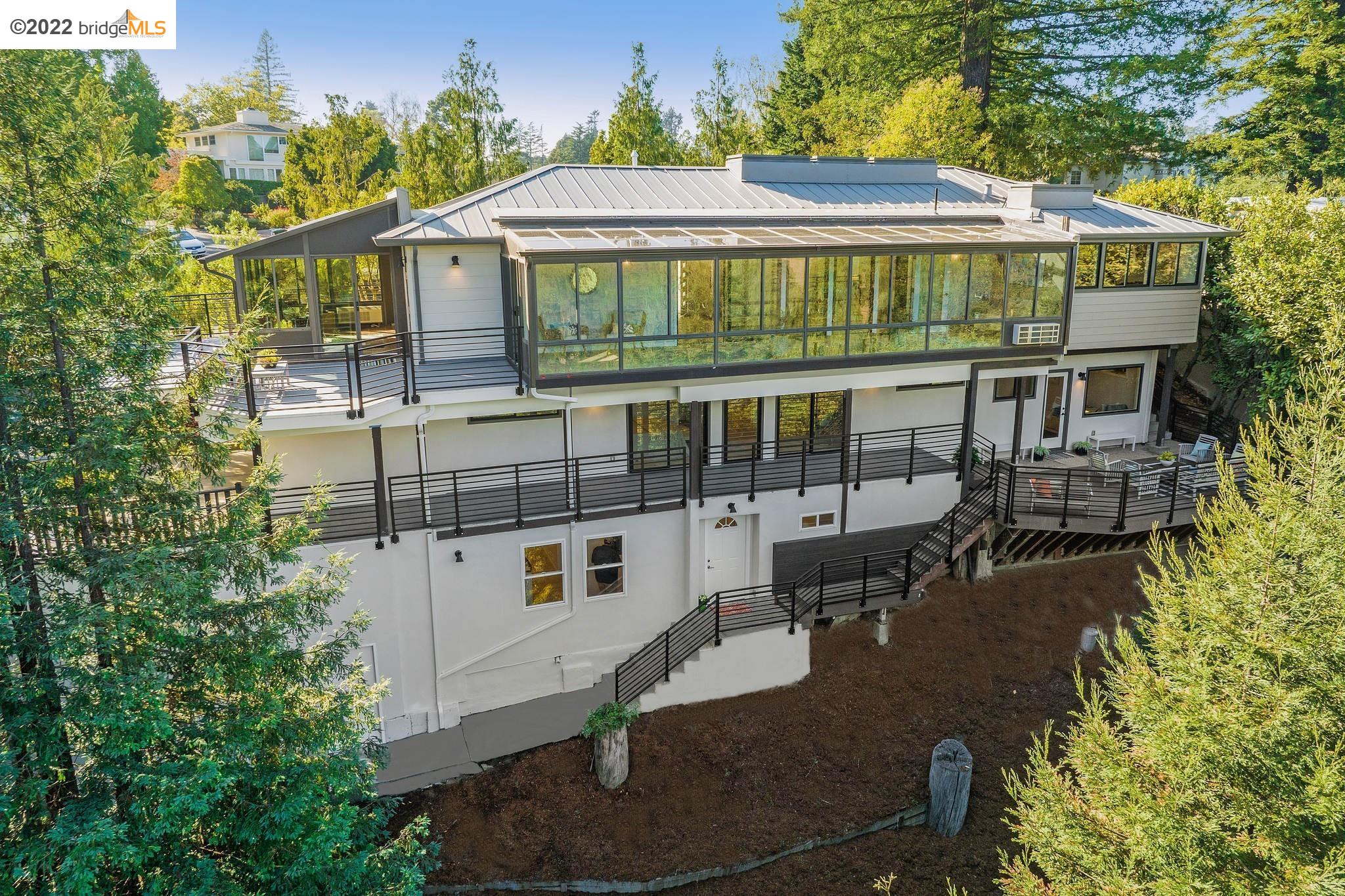 1051 Woodside Road Berkeley, CA 94708 - Photo 1 of 1 aerial view of a house with a yard balcony and furniture