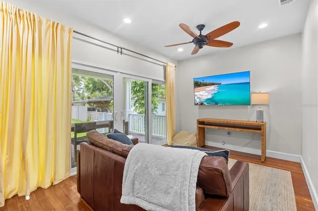 a living room with furniture and a window