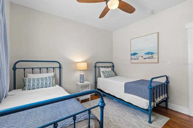 a bedroom with a bed and a lamp on table