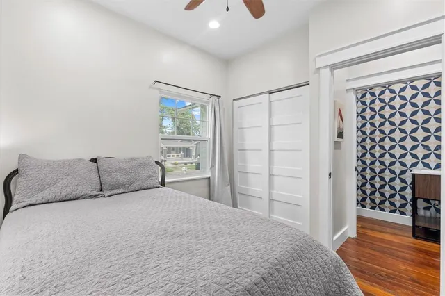 a bedroom with a bed and a walk in closet