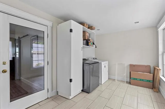 a view of kitchen with furniture and wooden floor