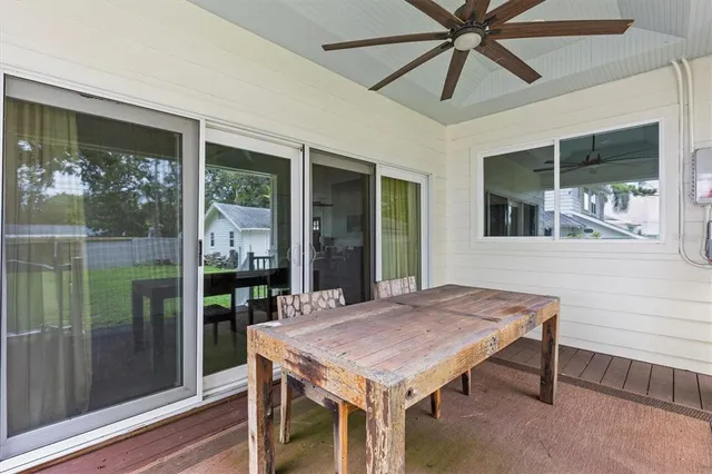 a view of a patio with a table and chairs