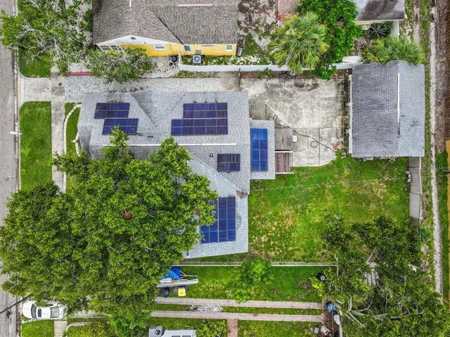 aerial view of a house with a yard