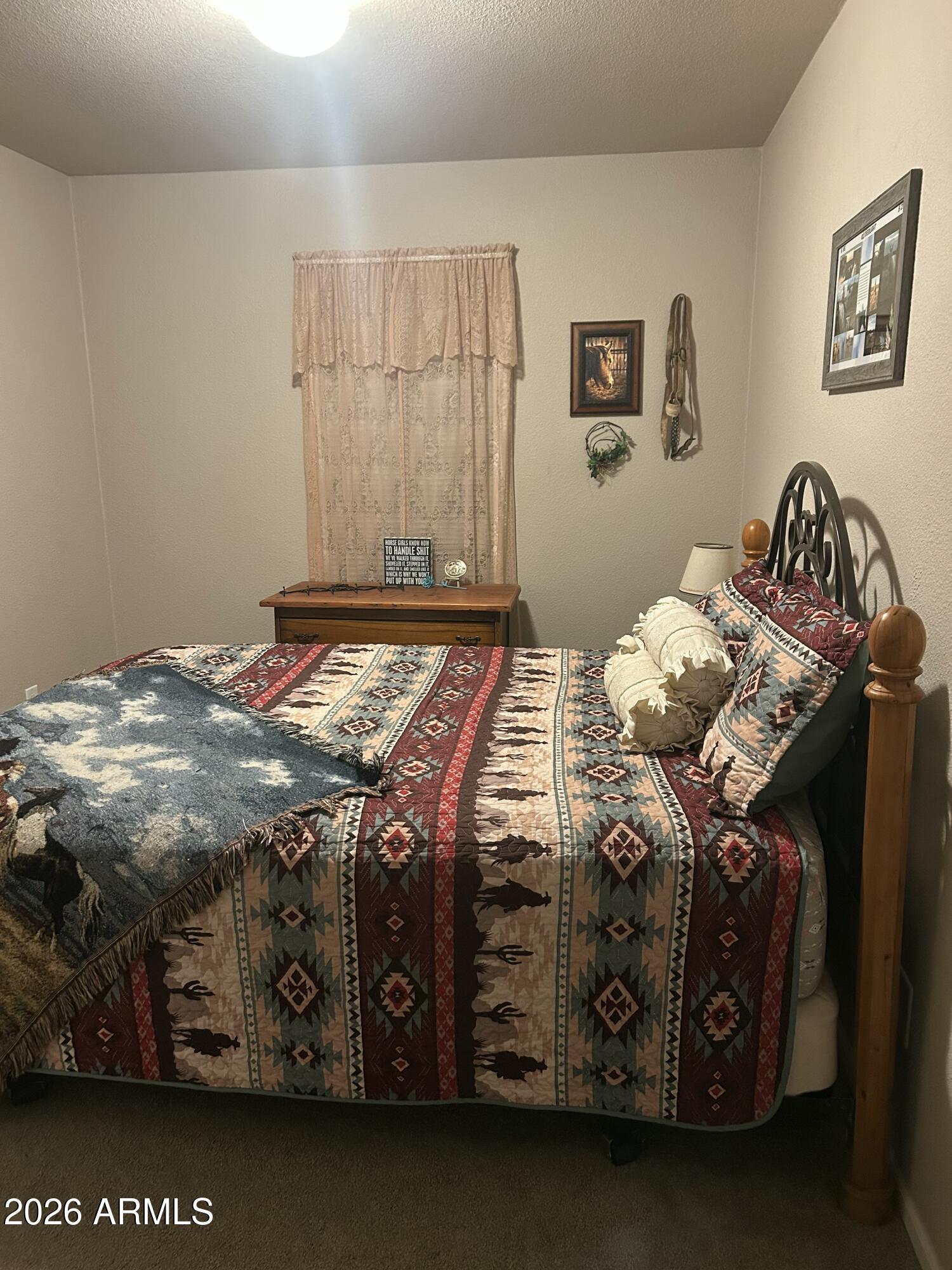 11873 North Reed Road Florence, AZ 85132 - Photo 18 of 21 a bedroom with a bed and a window