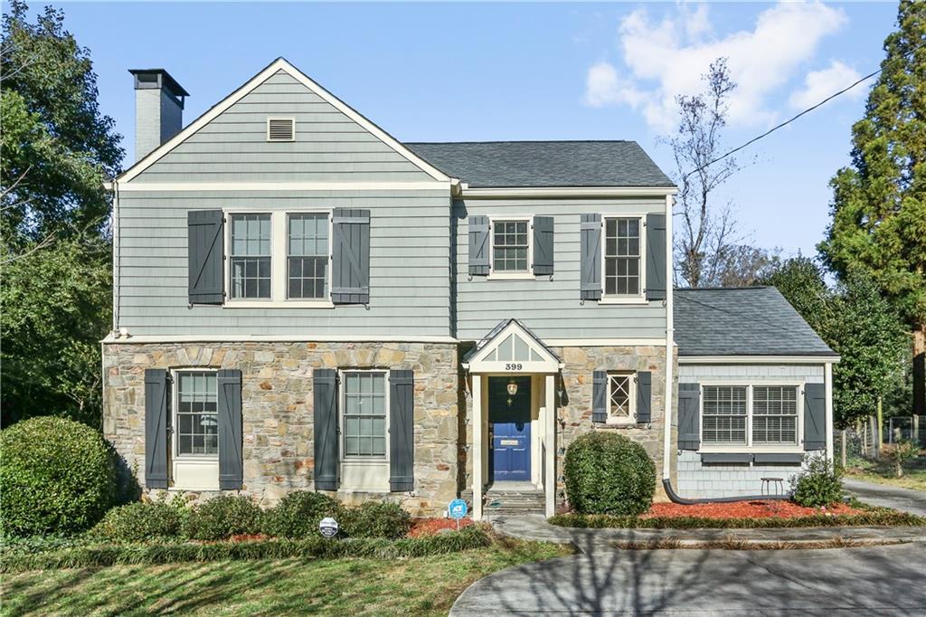 399 Collier Road Northwest Atlanta, GA 30309 - Photo 1 of 1 a front view of a house with garden