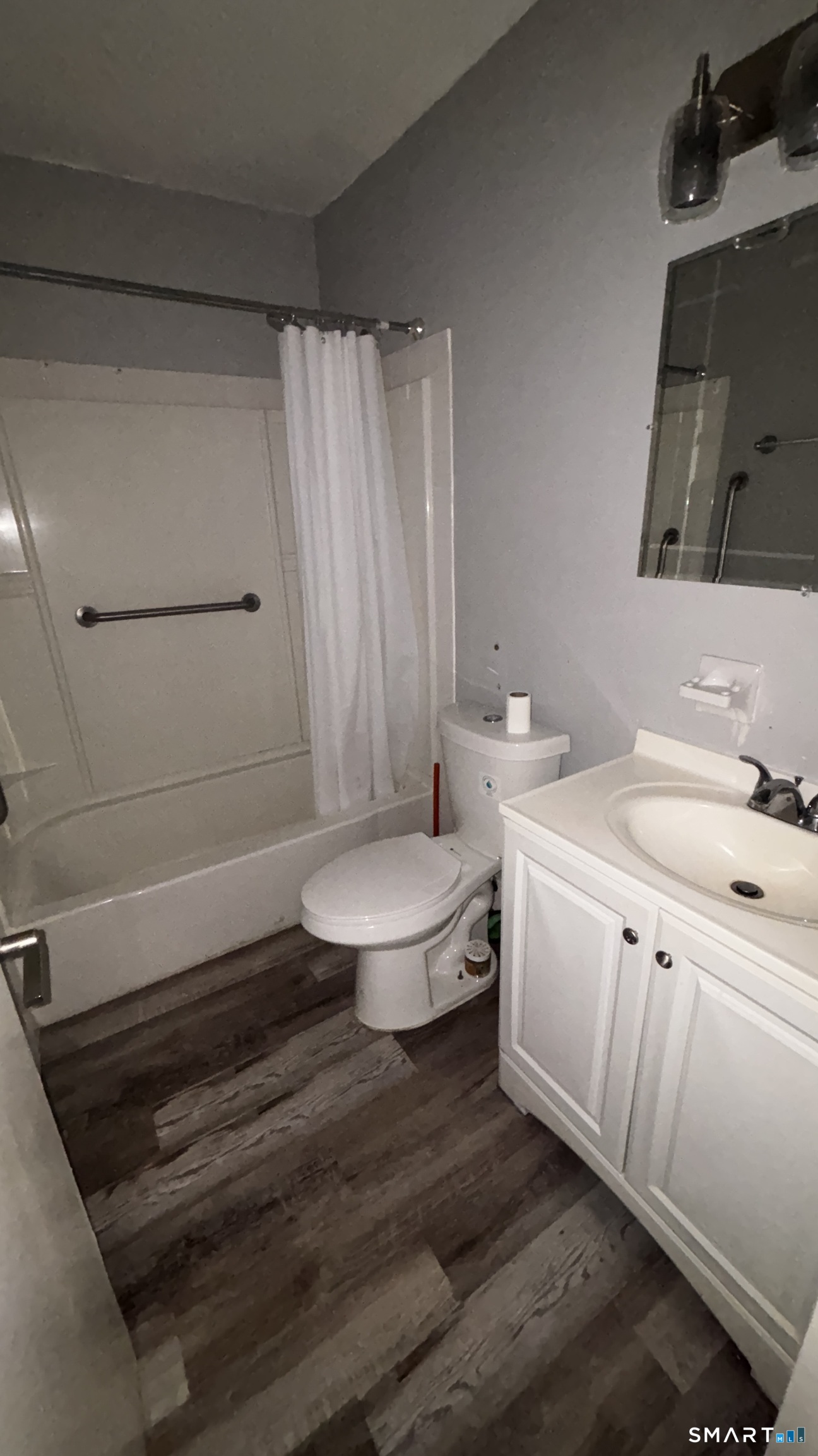 50 Greenhouse Road, Unit 33C Bridgeport, CT 06606 - Photo 17 of 33 a bathroom with a sink a toilet a mirror and shower