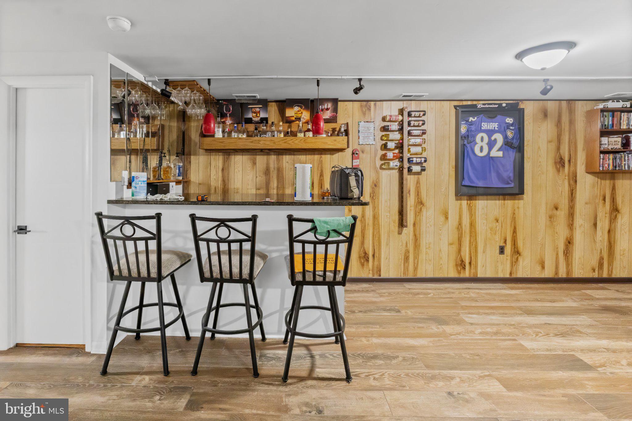 1317 Roxboro Road Baltimore, MD 21237 - Photo 22 of 30 Stylish basement bar with wooden accents.