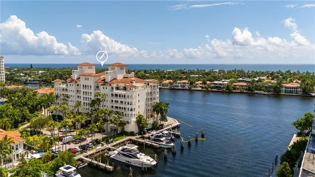 a kitchen that has a sink a stove and a refrigerator
