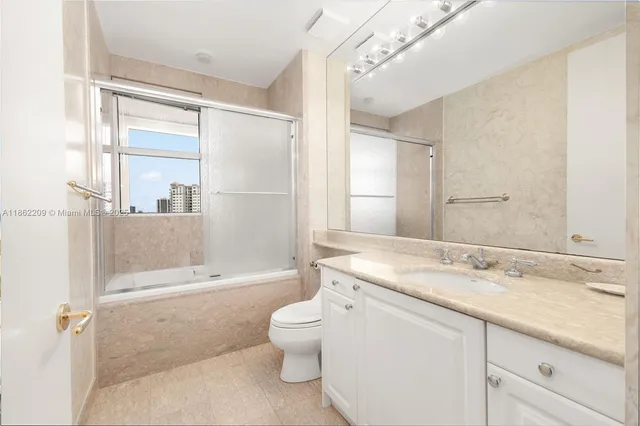 a living room with couch and a large window