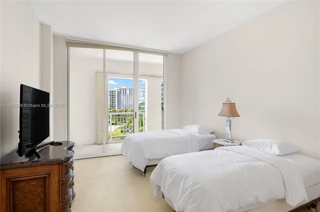 a large bathroom with a large mirror vanity and shower