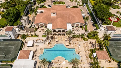 a front view of water with a large pool and outdoor seating
