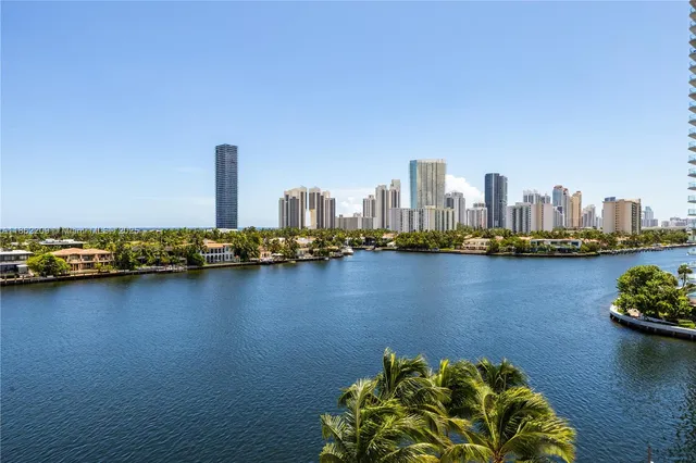 a view of a livingroom with furniture and a floor to ceiling window
