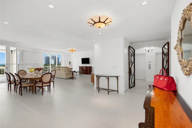 an empty room with sliding door and wooden floor