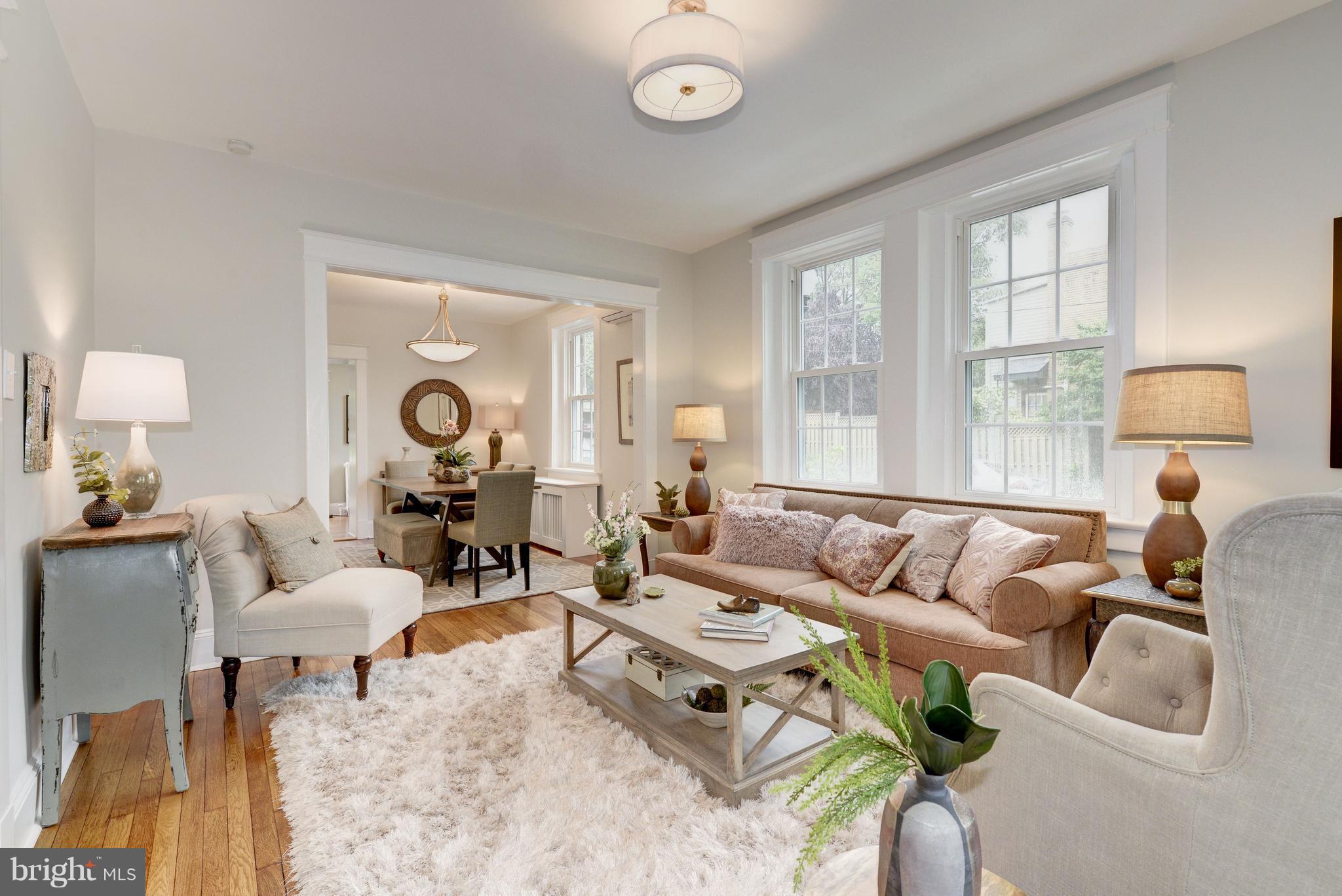 3601 T Street Northwest Washington, DC 20007 - Photo 5 of 20 a living room with furniture and a large window