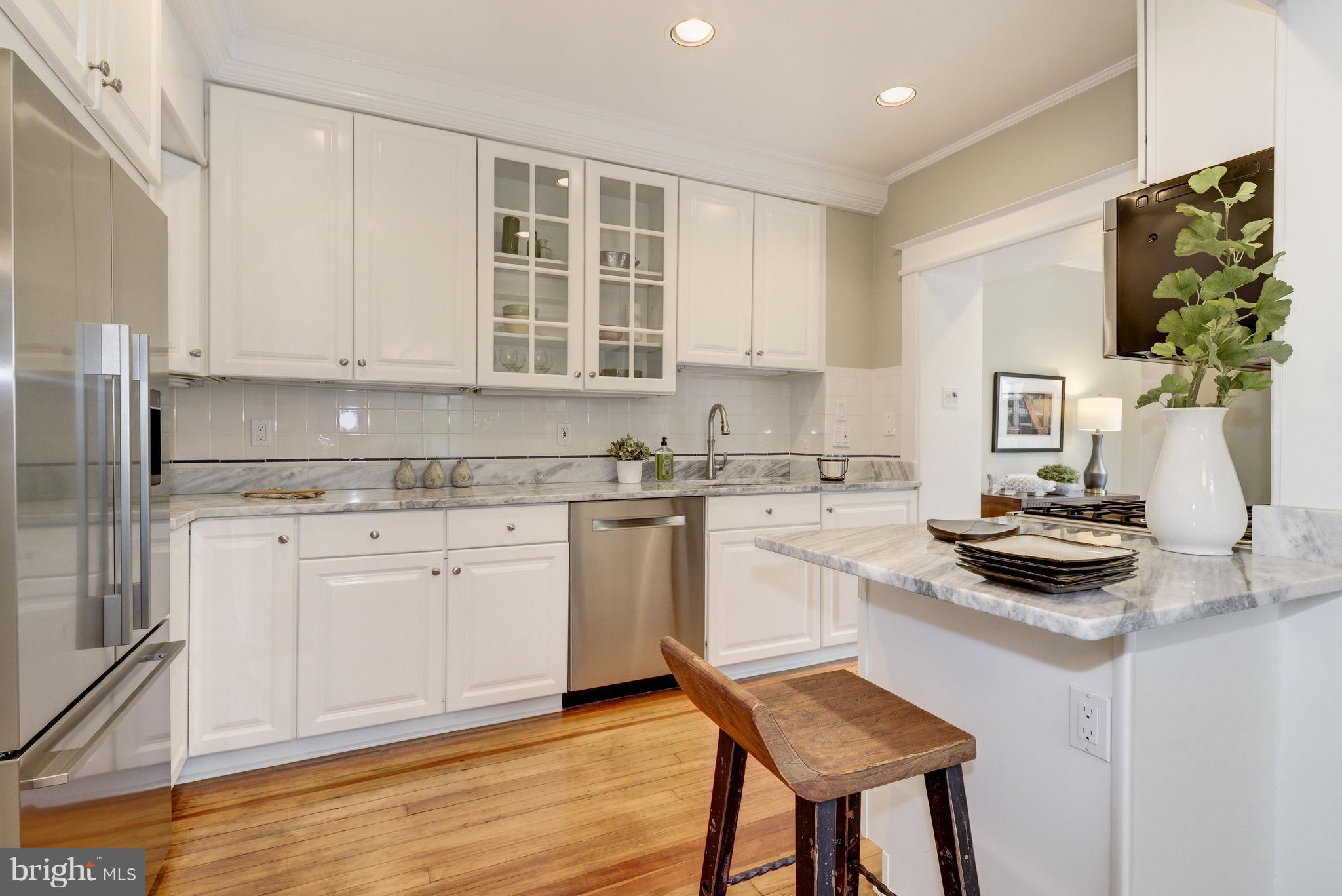 3601 T Street Northwest Washington, DC 20007 - Photo 7 of 20 a kitchen with a stove cabinets and wooden floor
