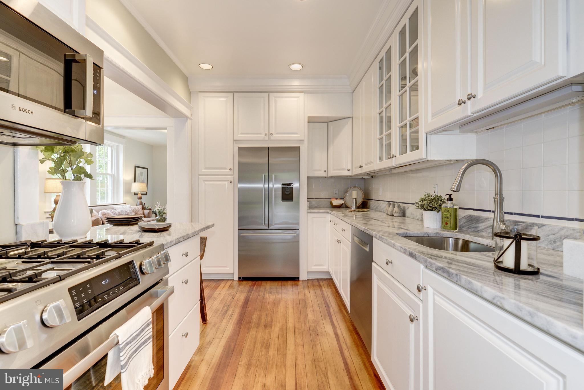 3601 T Street Northwest Washington, DC 20007 - Photo 8 of 20 a kitchen with sink a stove and refrigerator