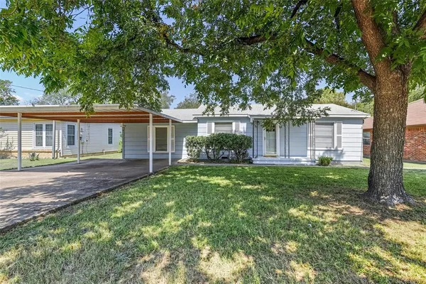front view of a house with a garden